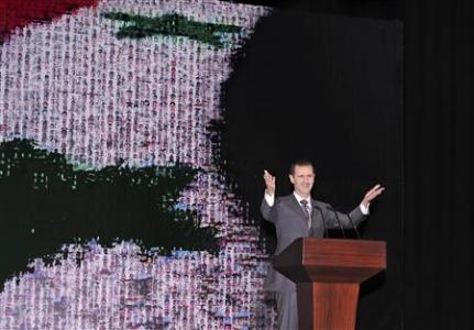 Syria's President Bashar al-Assad speaks at the Opera House in Damascus